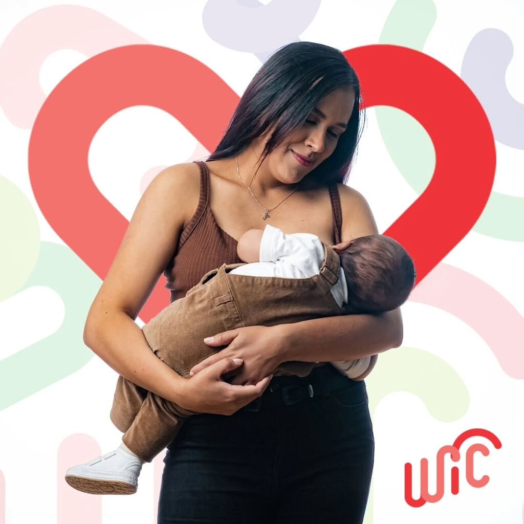 A woman breastfeeds her baby. Click to learn more about WIC's resources for breastfeeding mothers.