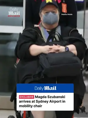 Magda Szubanski arrives at Sydney Airport in wheelchair
