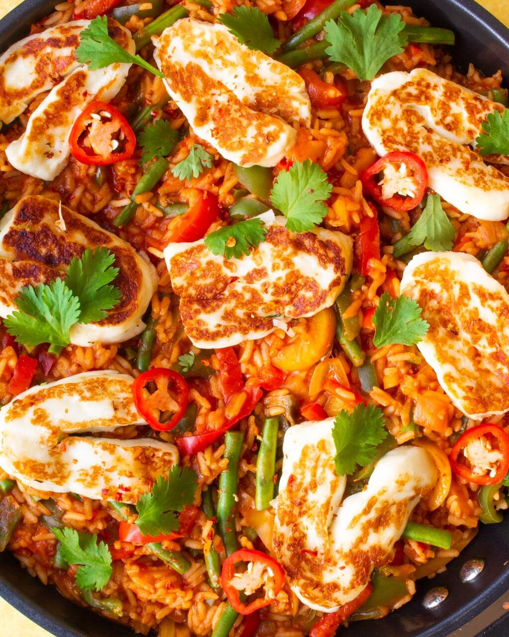 Spicy Tomato Rice topped with Halloumi and Coriander