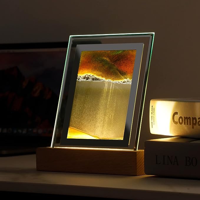 Backlit moving sand art