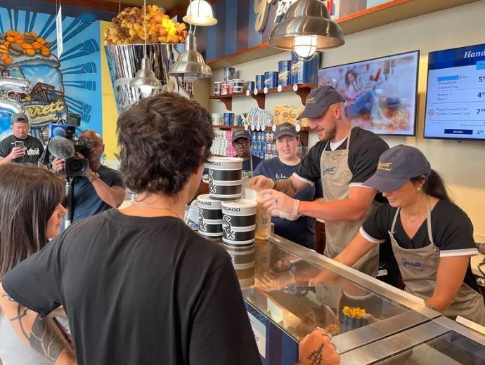 White Sox pitcher tosses out Garrett&rsquo;s Popcorn for charity campaign