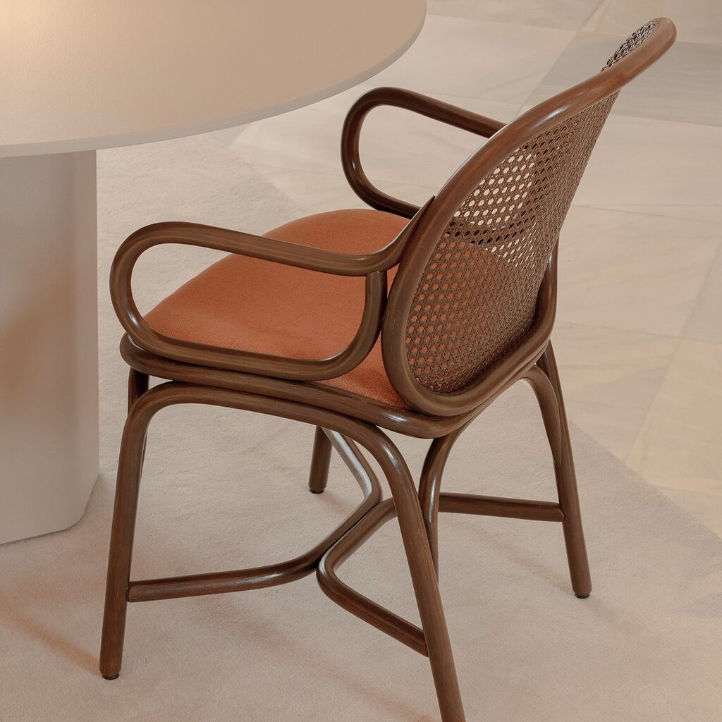 Frames rattan dining armchair is the younger and smaller member of this happy family of rattan objects defined by its rounded panels of rattan mesh 🥰