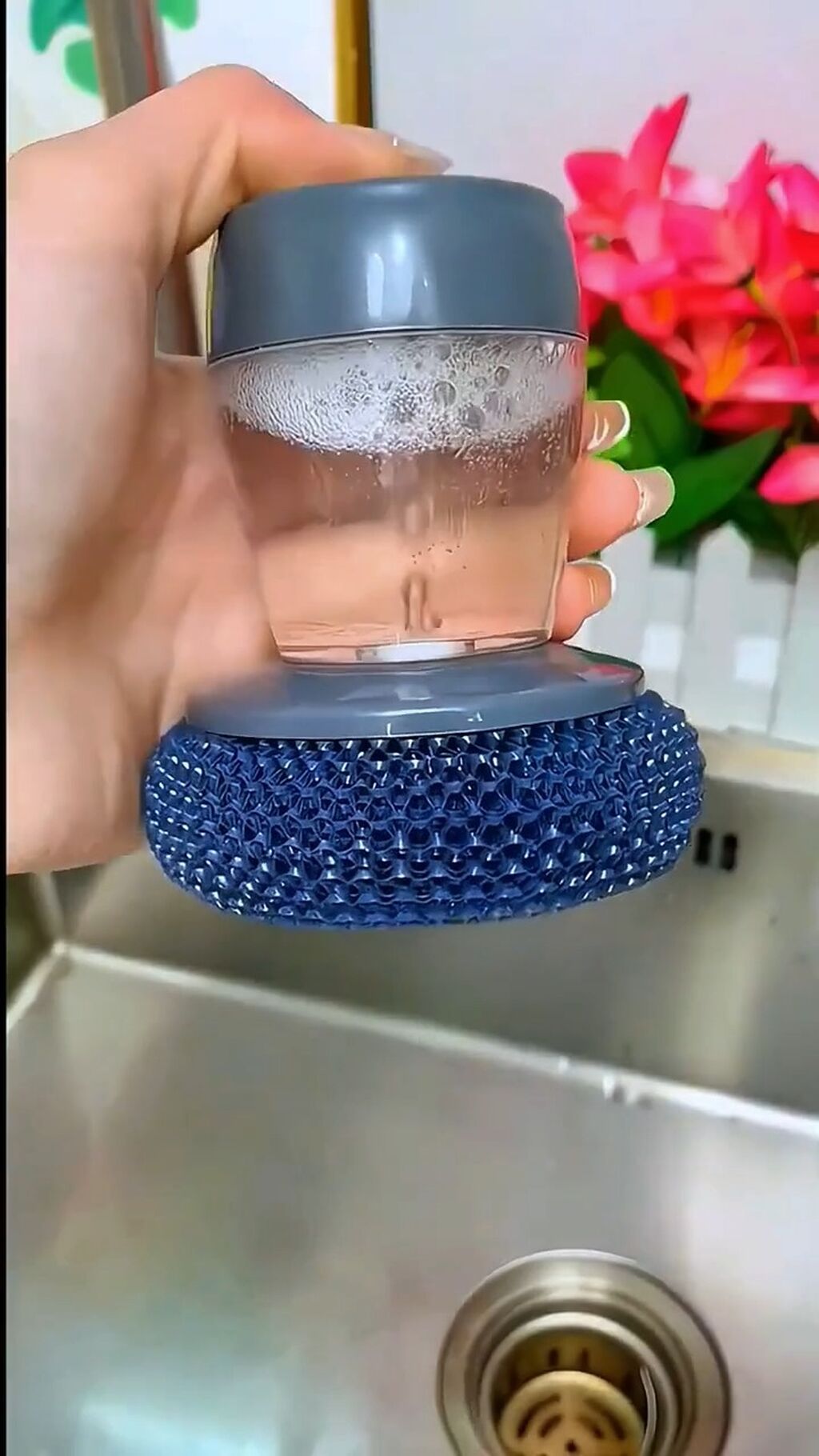 Sponge with dishwasing soap Dispenser